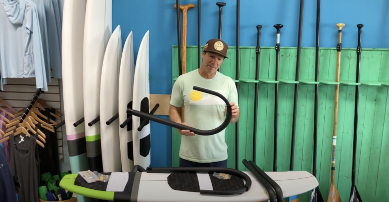 Racked ceiling SUP and surf rack