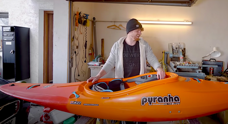 bren orton preparing his kayak for the season in the alps